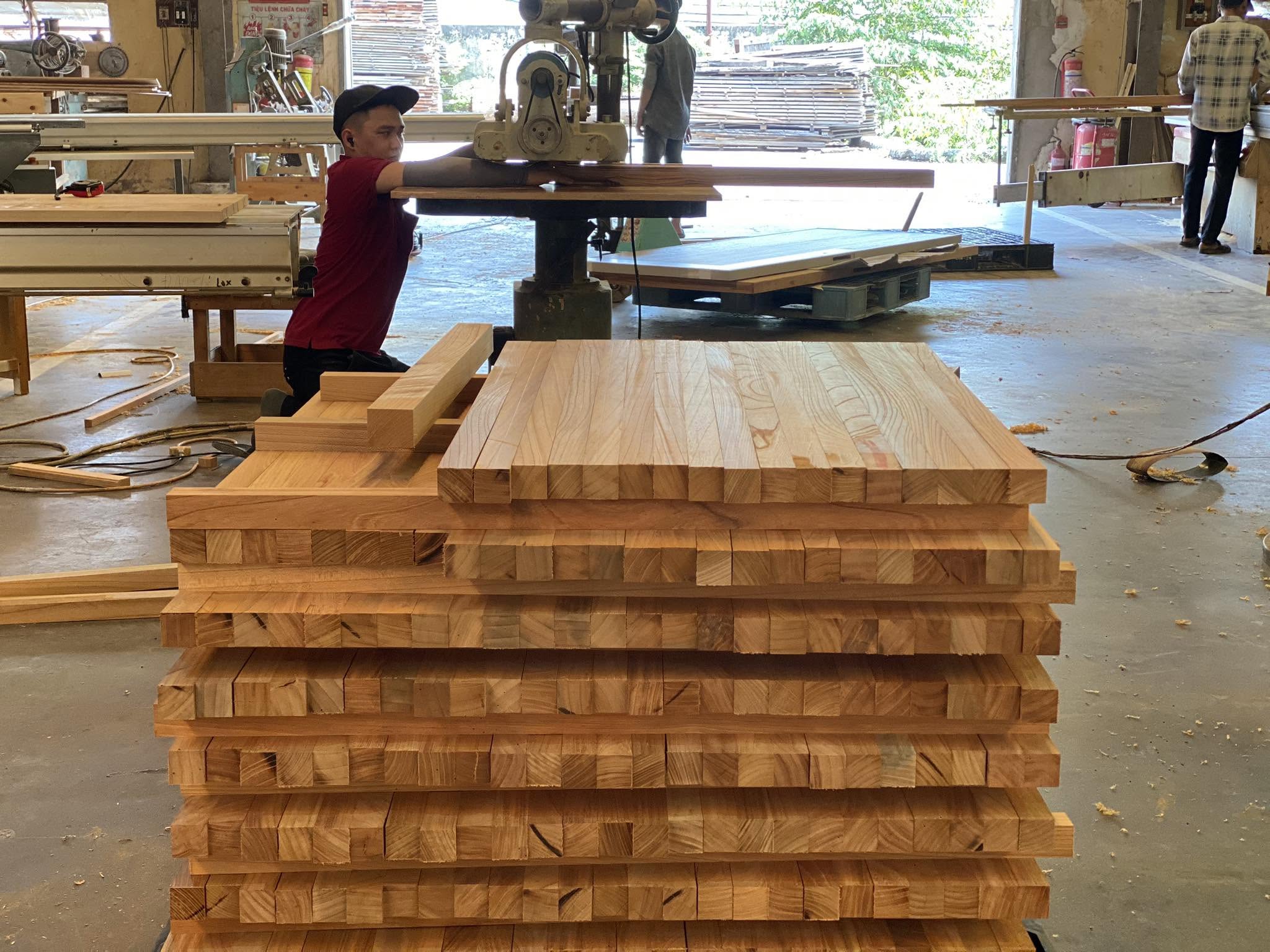 Close-up of Hinoki cypress grain — TNP's signature timber, sourced from Japan and manufactured in Vietnam